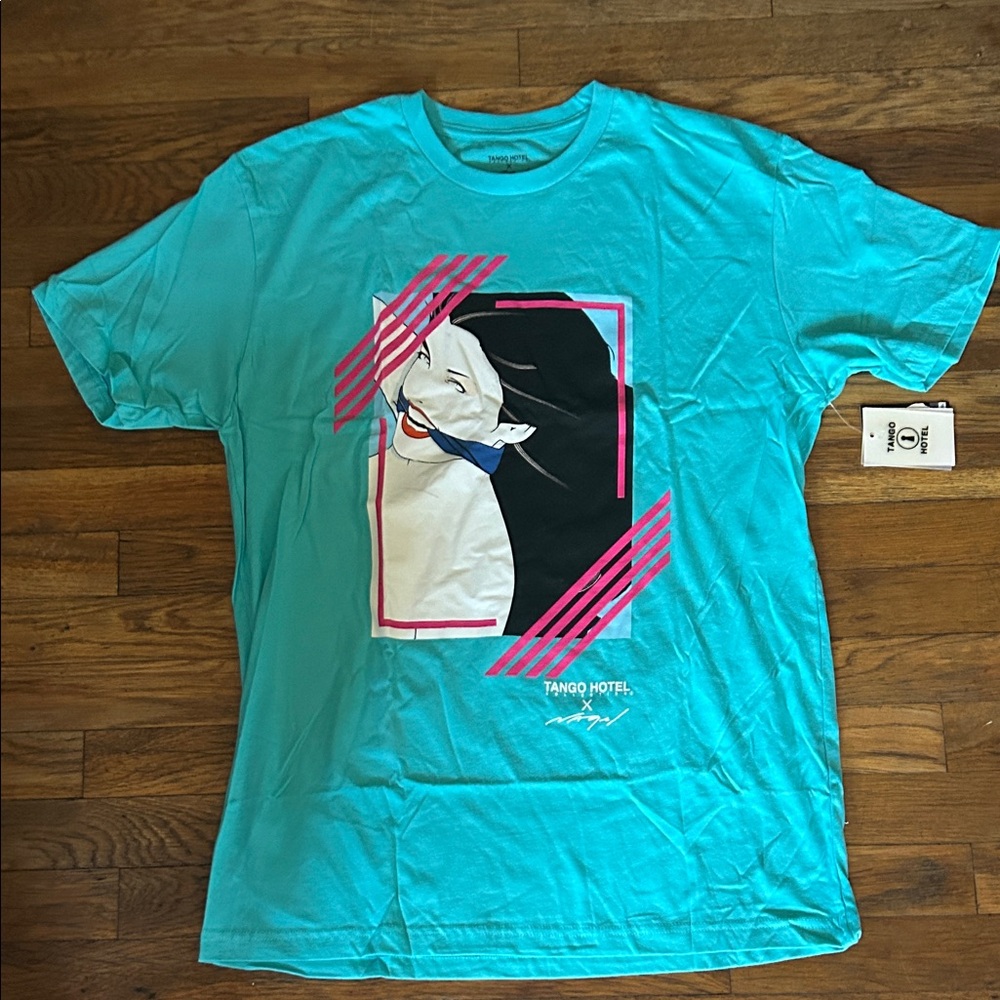 Teal Graphic Tee with Artistic Design